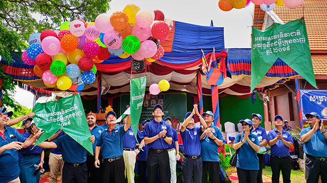 People celebrating with balloons in Cambodia.